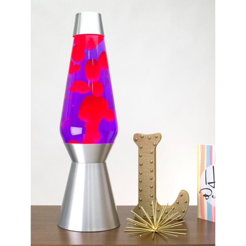 68210100US-LavaLamp-27-Pink-and-Purple-web 27” LAVA® Lamp Grande – Pink/Purple/Silver on a table with knick knacks